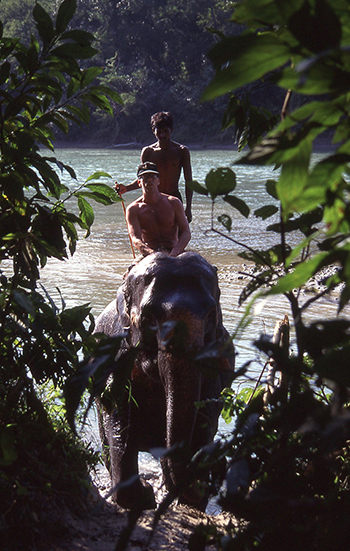 Young Dr Shinn riding an elephant_Nepal